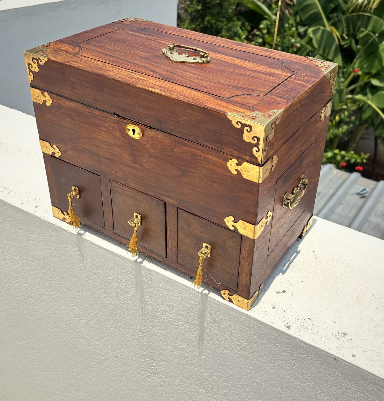 Teak cash chest with engraved brass fittings and three drawers