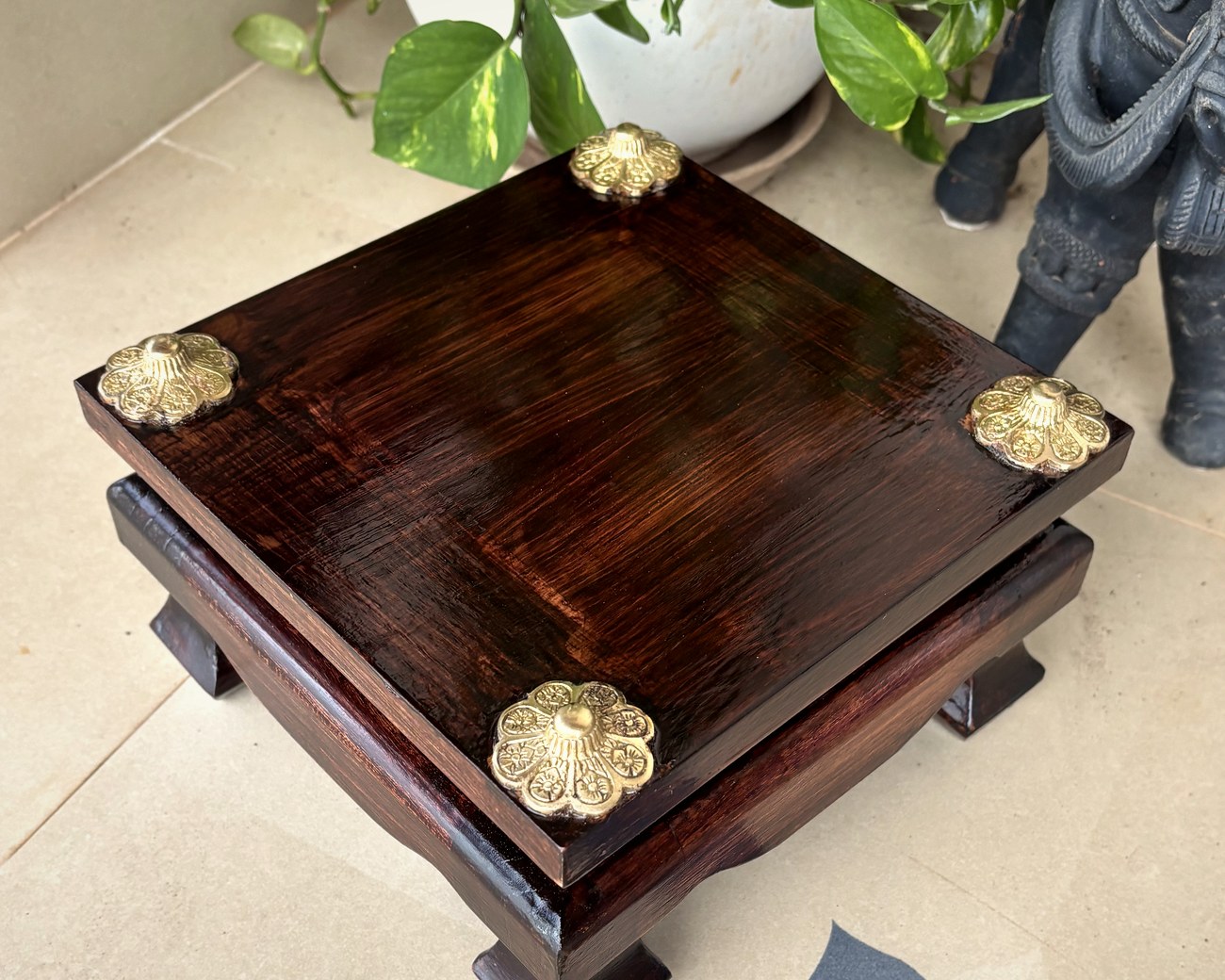 The chowki from above, showing the mitred top and four brass caps