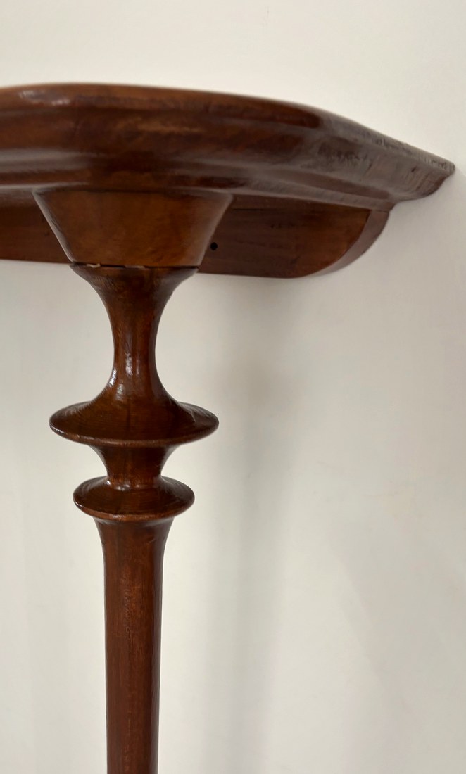 Sculpted collar and turnings on the modern foyer table leg